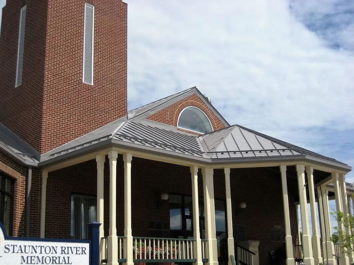 Skilled roofing craftsmen working on a residential roof in West Hazleton